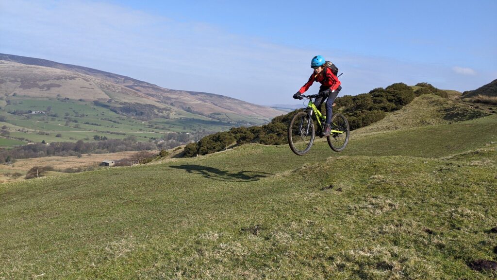 Grassy jumps on the Hollins Cross to Greenlands Farm descent