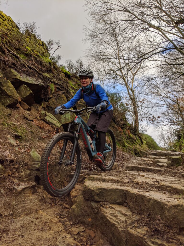Riding down the steps on the Rowarth Descent in the west Peak District